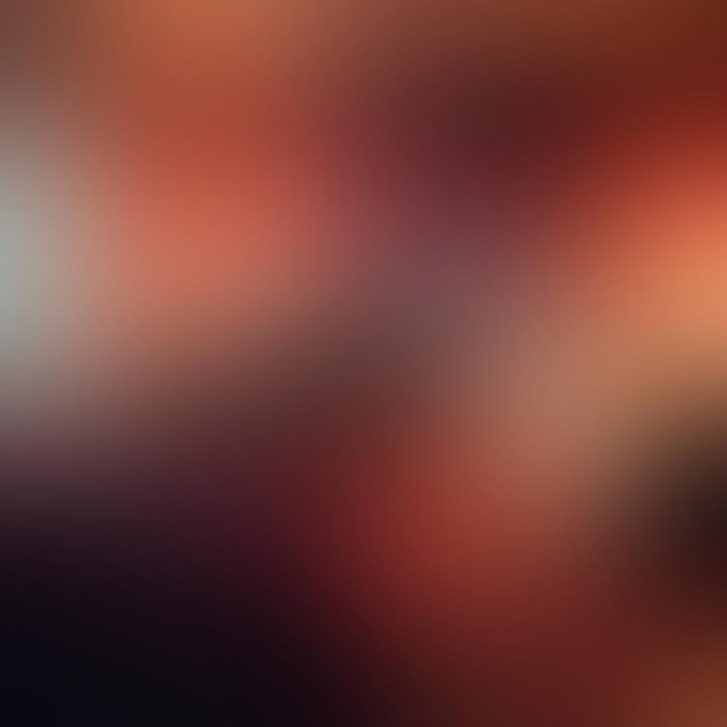 A soft-focus bedroom scene featuring two silhouettes of a couple intertwined, surrounded by a gradient of warm colors transitioning from sensual pastels to deep steamy reds. The atmosphere is inviting, with plush pillows and seductive lighting, emphasizing intimacy and passion. Ethereal elements like silk sheets and rose petals enhance the romantic ambiance. surreal art style. vibrant colors. soft lighting.